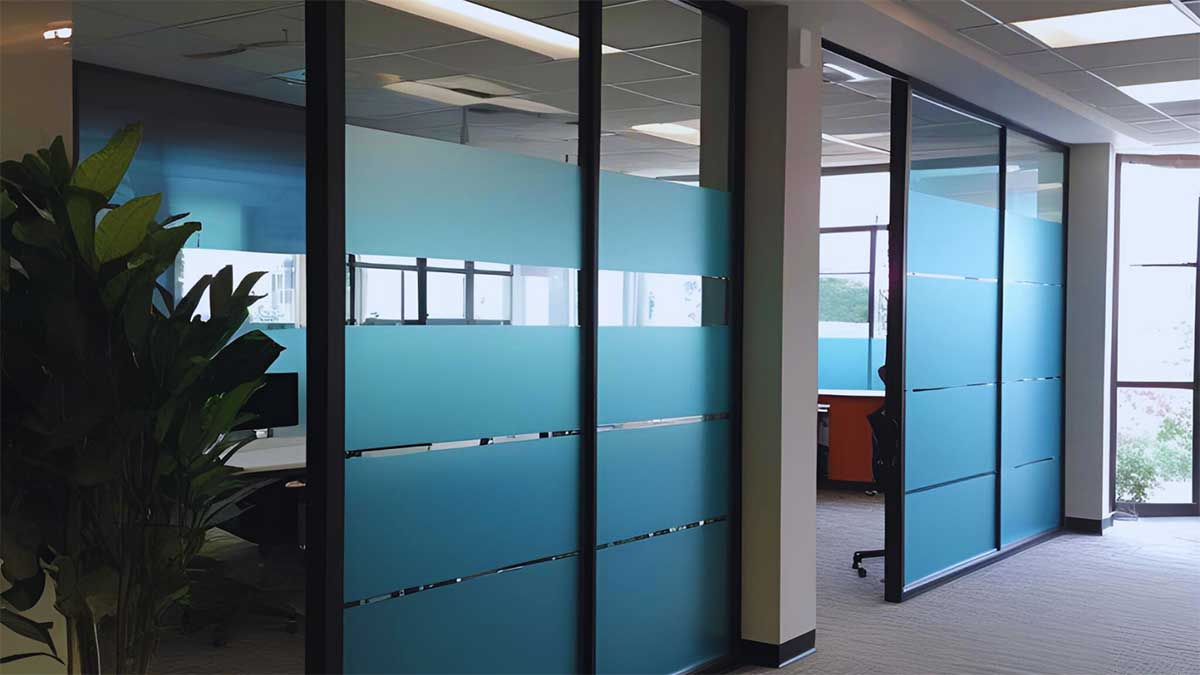 Conference room with decorative commercial window tint for improved privacy and natural light diffusion. 